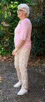 Side view pink short sleeve top.