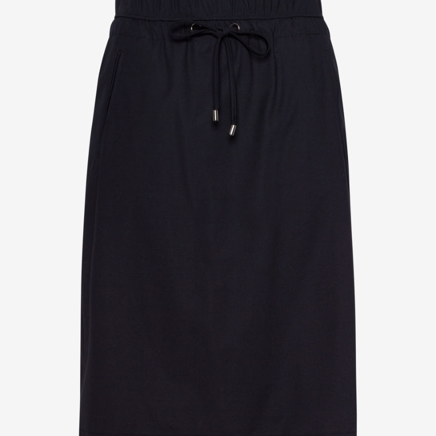 Front view A black Peggy Skirt Raphaela with a straight silhouette and high rise waist.