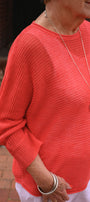 Person wearing a red sweater .