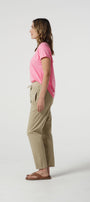 pink cotton tee  and beige pants.