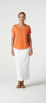  orange cotton tee and white pants 