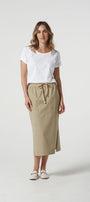 white cotton t-shirt and beige skirt 