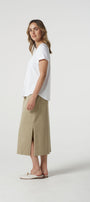 white  cotton t-shirt and beige skirt .