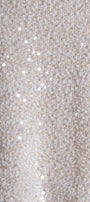 A close-up of a textured cream or off-white fabric with scattered reflective silver sequins.