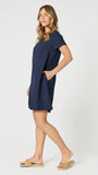 Woman wearing a navy blue dress on a white background