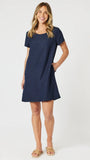 Woman wearing a navy blue dress on a white background
