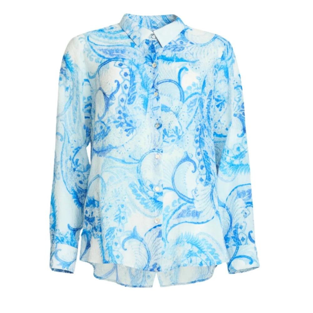 A long sleeve button up blouse with a white base and a blue paisley pattern.