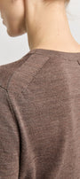 Close-up of a brown textured garment on a plain background