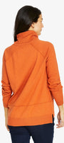 Woman wearing an orange sweater on a white background