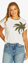 A woman wearing a white short-sleeve t-shirt with a green palm tree graphic on the front, paired with blue jeans, against a plain white background.