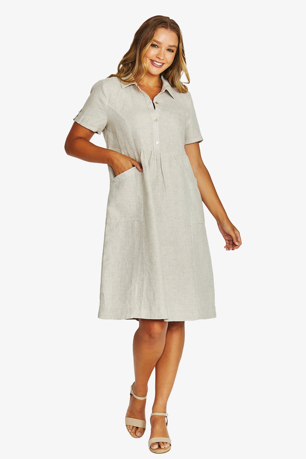 Front View light beige linen shirt dress with short sleeves, a button down collar, and front patch pockets.