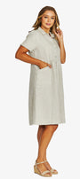 Front View  light beige linen shirt dress with short sleeves, a button down front, and a collar, paired with beige wedge sandals.