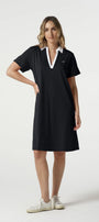 Woman wearing a black dress with white collar on a white background