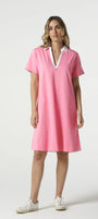 Woman wearing a pink dress with a white collar on a white background