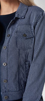 Close up of a person wearing a blue and white striped shirt.
