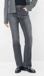 Person wearing gray jeans and a grey blazer 