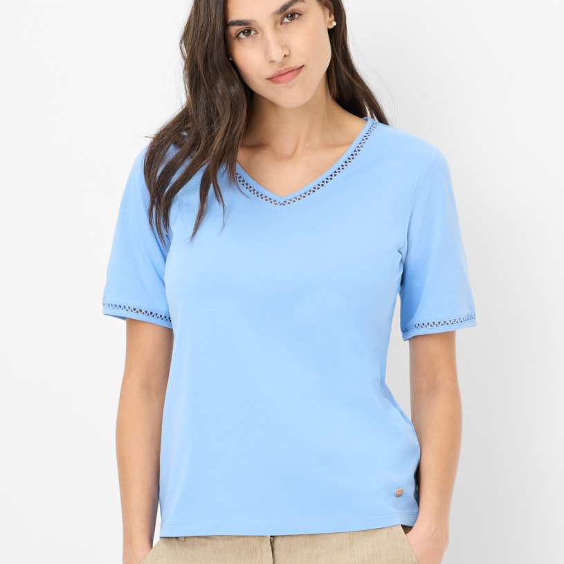 Front view a light blue short sleeve top with decorative trim.
