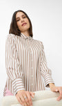 Woman wearing a striped shirt .