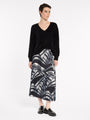 "Marco Polo Casablanca Pleated Skirt — exclusive Black and Ivory print with all-over pleats"