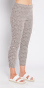 Person wearing patterned pants on a white background