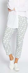 Person wearing a white shirt and patterned pants on a plain background