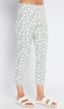 White pants with a subtle pattern worn by a person on a white background