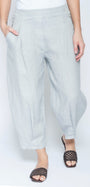 A person wearing light gray wide-leg cropped pants with side pockets, paired with black woven slide sandals, shown against a plain white studio background.
