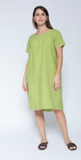Front view short sleeve, knee length lime green linen dress against a light grey studio background.