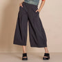  black wide leg cropped pants with side pockets, paired with black platform sandals.