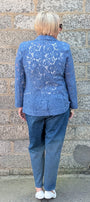 Cobalt Lace jacket, blue jeans, and white shoes.