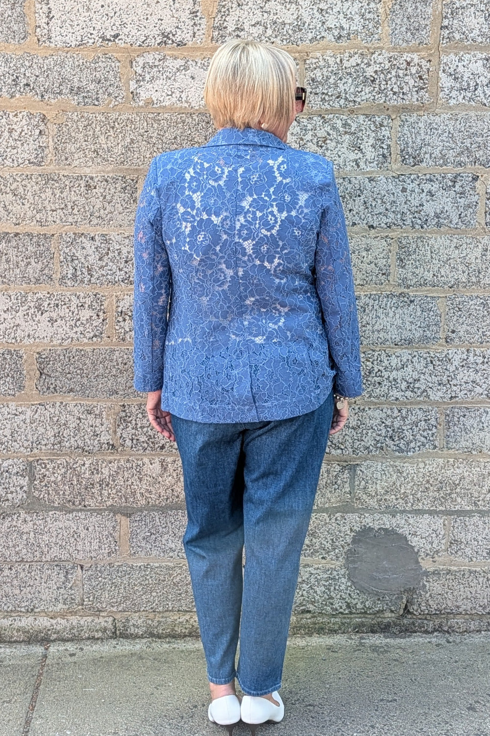 Cobalt Lace jacket, blue jeans, and white shoes.