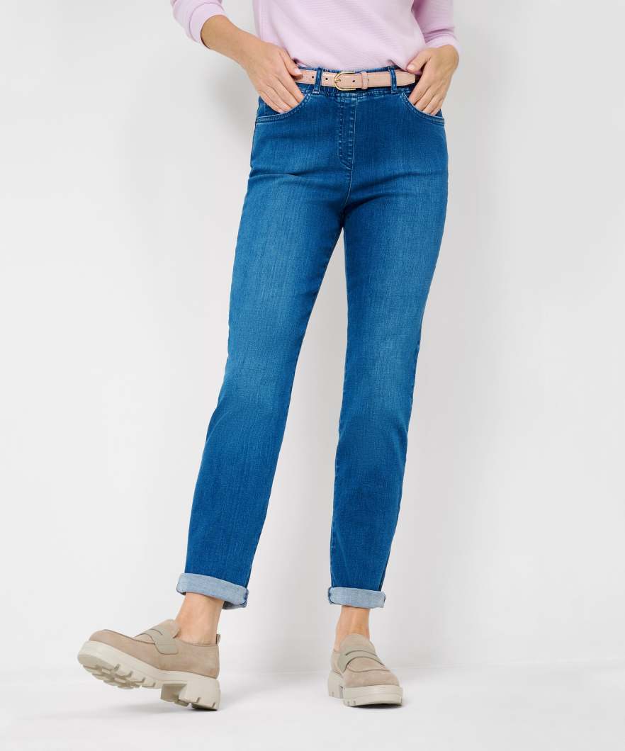 Front view  a pink long sleeve top and blue jeans with a high waist and slim fit. 