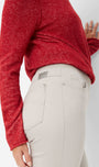 Side view a red sweater and beige pants 