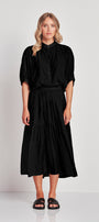 shirt with Mandarin collar and button front plackard.  Elbow length sleeve with half elasticated cuff. The Rotate shirt falls just below the hip.