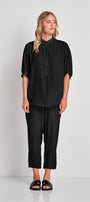 Shirt with Mandarin collar and button front plackard.&nbsp; Elbow length sleeve with half elasticated cuff.&nbsp; The Rotate shirt falls just below the hip.