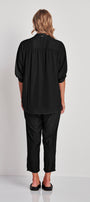 shirt with Mandarin collar and button  back view. Elbow length sleeve with half elasticated cuff.&nbsp; The Rotate shirt falls just below the hip.