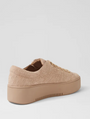 Beige woven platform sneaker on a light gray background