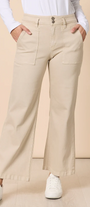 Person wearing beige pants with a plain background