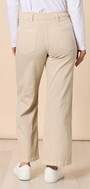 Beige pants worn by a person on a beige background