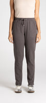 Person wearing gray sweatpants on a white background