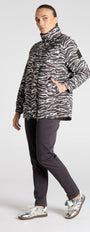 Person wearing a zebra print jacket on a white background