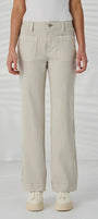 light beige wide leg jeans with a white top and white sneakers.
