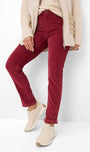 Person wearing red pants and beige shoes 