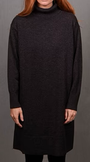 Person wearing a dark gray turtleneck dress.