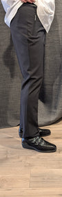 Side view of black pants and black shoes 