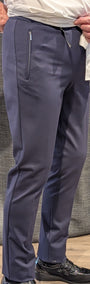 Front view  navy pants with a zipper pocket.