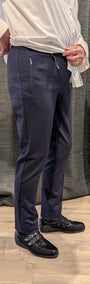 Side view navy pants and a white shirt.