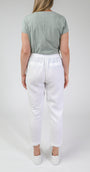 back view white linen pants and a sage t-shirt.