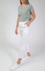 white linen pants and a sage t-shirt.