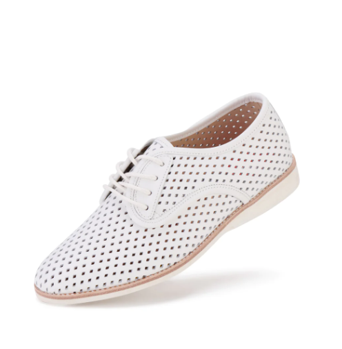 A pair of white flats with a smooth leather upper, 